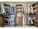 Walk-in closet with custom shelving and drawers, providing ample storage space at 12059 S Tallkid Ct, Parker, CO 80138