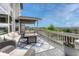 Relaxing deck area with comfortable seating, an outdoor fire pit, and panoramic views of the surrounding landscape at 12059 S Tallkid Ct, Parker, CO 80138