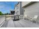Outdoor deck featuring a grill, comfortable seating, and a tranquil setting, perfect for outdoor relaxation at 12059 S Tallkid Ct, Parker, CO 80138