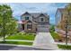 Charming two-story home with stone accents, landscaped yard, and attached garage at 12059 S Tallkid Ct, Parker, CO 80138