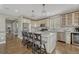 Spacious kitchen features a large center island, modern appliances, and ample storage space at 12059 S Tallkid Ct, Parker, CO 80138