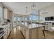 Bright open floor plan with a gourmet kitchen featuring granite countertops and stainless steel appliances at 12059 S Tallkid Ct, Parker, CO 80138
