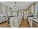 Open floor plan with a kitchen with modern appliances, a large island, and a barstool seating at 12059 S Tallkid Ct, Parker, CO 80138