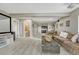 Spacious living room features plush carpet, recessed lighting and convenient wet bar at 12059 S Tallkid Ct, Parker, CO 80138