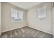 Cozy bedroom with ample natural light from two windows at 5107 S Fairplay St, Aurora, CO 80015
