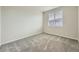 Neutral bedroom with plush carpeting and a large window at 5107 S Fairplay St, Aurora, CO 80015