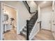 Inviting entryway with staircase and access to powder room at 5107 S Fairplay St, Aurora, CO 80015