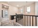 Upstairs hallway boasts neutral walls, plush carpeting, and a built-in desk area at 5107 S Fairplay St, Aurora, CO 80015