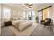 Spacious main bedroom with balcony access, soft carpet, and a sliding barn door at 5107 S Fairplay St, Aurora, CO 80015