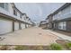 Street view showing row of townhomes with garages and well-maintained exteriors at 5107 S Fairplay St, Aurora, CO 80015