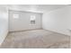 Bright bedroom with neutral carpet, white walls and two windows for ample natural light at 4635 Cattle Cross Trl, Castle Rock, CO 80104