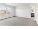 Bright bedroom with neutral carpet, white walls and a window that overlooks a field at 4635 Cattle Cross Trl, Castle Rock, CO 80104