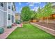 Lush backyard featuring a well-maintained lawn and patio area at 2810 Shadow Dance Dr, Castle Rock, CO 80109