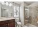 Bathroom featuring single sink vanity, shower, and a window at 2810 Shadow Dance Dr, Castle Rock, CO 80109