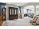 Open dining room with neutral carpet, columns, and an elegant chandelier at 2810 Shadow Dance Dr, Castle Rock, CO 80109