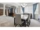 Open concept dining room with light-filled windows and access to the living area at 2810 Shadow Dance Dr, Castle Rock, CO 80109