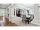 Dining room area showcasing hardwood floors, white columns and a modern chandelier at 2810 Shadow Dance Dr, Castle Rock, CO 80109