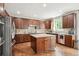 Spacious kitchen featuring dark wood cabinets, granite countertops, and stainless steel appliances at 2810 Shadow Dance Dr, Castle Rock, CO 80109