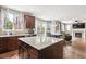 Kitchen island featuring granite countertops, ample cabinet space, and backyard views at 2810 Shadow Dance Dr, Castle Rock, CO 80109