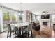 Open living space featuring a fireplace, comfortable seating, and bright natural light at 2810 Shadow Dance Dr, Castle Rock, CO 80109