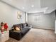 Finished basement with neutral decor and carpeted floors at 5557 S Simms Way, Littleton, CO 80127