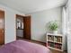 Cozy bedroom featuring a plant and view to adjoining room at 5557 S Simms Way, Littleton, CO 80127