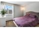 Bright bedroom with neutral tones and large windows, offering a serene atmosphere at 5557 S Simms Way, Littleton, CO 80127