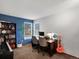 Bright office space with large windows, built-in shelving, and stylish decor at 5557 S Simms Way, Littleton, CO 80127