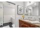 Bathroom showcasing a marble countertop, wooden vanity, and a bathtub at 1863 Wazee St # 4E, Denver, CO 80202