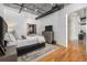 Contemporary bedroom featuring hardwood floors, closet, and modern design elements at 1863 Wazee St # 4E, Denver, CO 80202