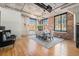 Large dining space with exposed brick walls, hardwood floors, and industrial-chic design at 1863 Wazee St # 4E, Denver, CO 80202