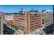 Attractive exterior view of a historic building with brick facade and water tower in a bustling urban environment at 1863 Wazee St # 4E, Denver, CO 80202