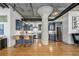 Bright, updated kitchen with stainless steel appliances, dark blue cabinetry, and concrete column feature at 1863 Wazee St # 4E, Denver, CO 80202