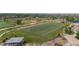 Aerial view of the community park, showcasing a football field, sports fields, and green spaces at 5255 Memphis St # 811, Denver, CO 80239