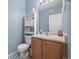 Cozy bathroom featuring a vanity with storage and a well-lit mirror, all in a compact space at 5255 Memphis St # 811, Denver, CO 80239