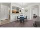 Dining area with a glass table and four chairs is conveniently located near the kitchen at 5255 Memphis St # 811, Denver, CO 80239