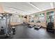 Well-equipped fitness center featuring treadmills, elliptical machines, and weight training equipment at 5255 Memphis St # 811, Denver, CO 80239