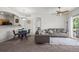 Neutral living room with an open floor plan features a gray sofa, glass table with chairs, and a ceiling fan at 5255 Memphis St # 811, Denver, CO 80239