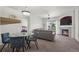 Cozy living room with a fireplace, carpet floors, neutral paint, and view of the outdoors from the sliding glass door at 5255 Memphis St # 811, Denver, CO 80239
