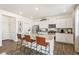 Bright kitchen features a large island with bar seating and stainless steel appliances at 27664 E Byers Ave, Aurora, CO 80018