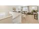 Upstairs loft area with comfortable seating and large windows offering plenty of natural light at 27664 E Byers Ave, Aurora, CO 80018