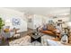 Bright and airy living room with open floor plan and modern decor at 27664 E Byers Ave, Aurora, CO 80018