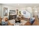 Cozy living room with wood floors, stylish furnishings, and decorative accents at 27664 E Byers Ave, Aurora, CO 80018
