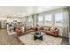 Inviting living room with wood floors and lots of natural light, perfect for entertaining at 27664 E Byers Ave, Aurora, CO 80018