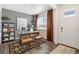 Modern home office featuring stylish decor, wood floors, and a bright window at 27664 E Byers Ave, Aurora, CO 80018