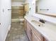 Bathroom featuring bath tub with shower, vanity with mirror, and tiled floors at 630 S Youngfield Ct, Lakewood, CO 80228