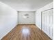 Bedroom showcasing wood floors, a window with a view, and closet with double doors at 630 S Youngfield Ct, Lakewood, CO 80228