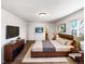 Spacious main bedroom features hardwood floors, ensuite, and large window at 630 S Youngfield Ct, Lakewood, CO 80228