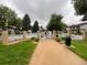 Community pool area with a black metal fence and multiple access points off of a sidewalk at 630 S Youngfield Ct, Lakewood, CO 80228