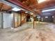 Unfinished basement area with exposed ceiling, concrete floor, washer, dryer and utilities at 13784 W 67Th Way, Arvada, CO 80004
